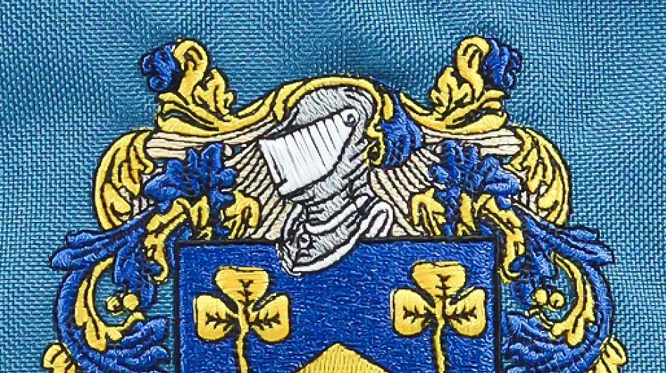 Embroidered logo on textile fabric showing an example of custom apparel decoration